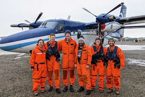 Flight crew in front of plane