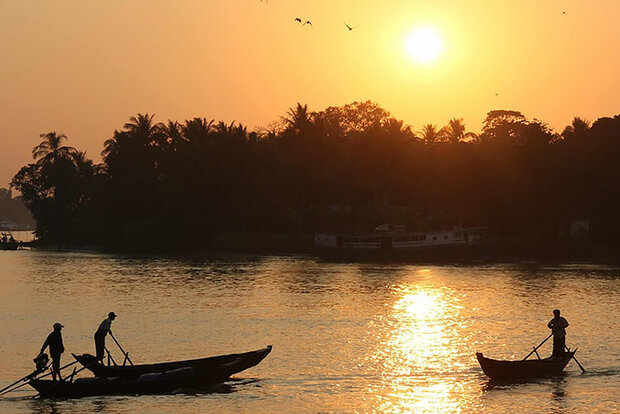 Boaters at sunset