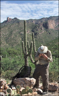 Bertelsen using a hand lens